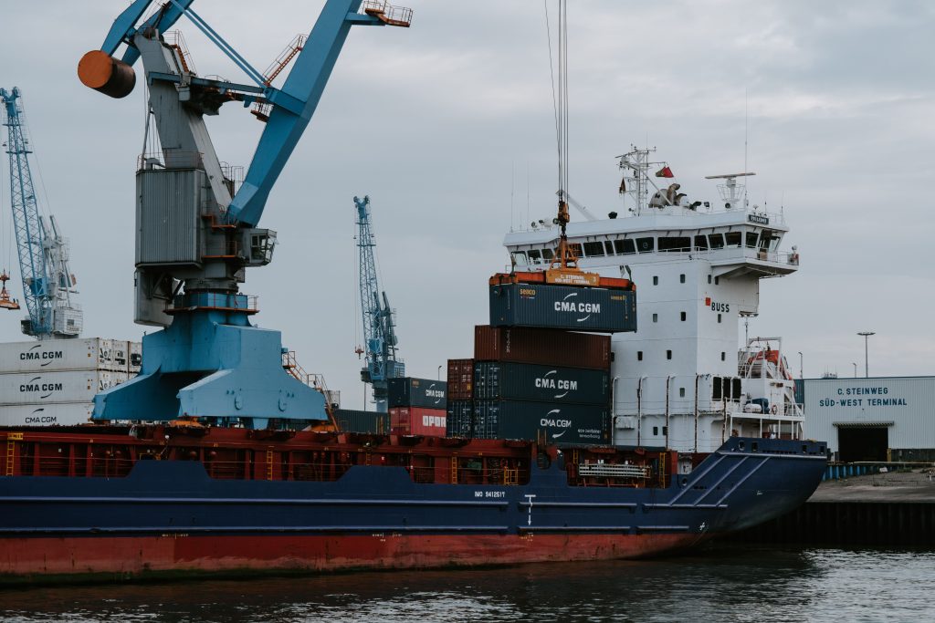 Cargo ship beside a port crane during loading